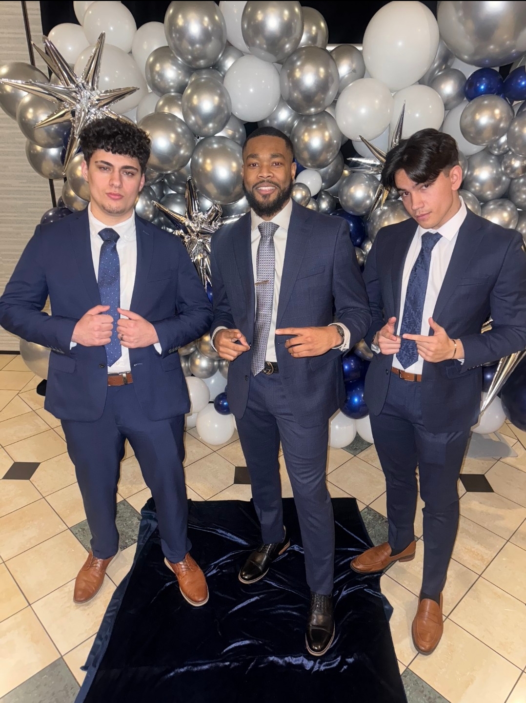 Three Valiant Branch team members at a company event